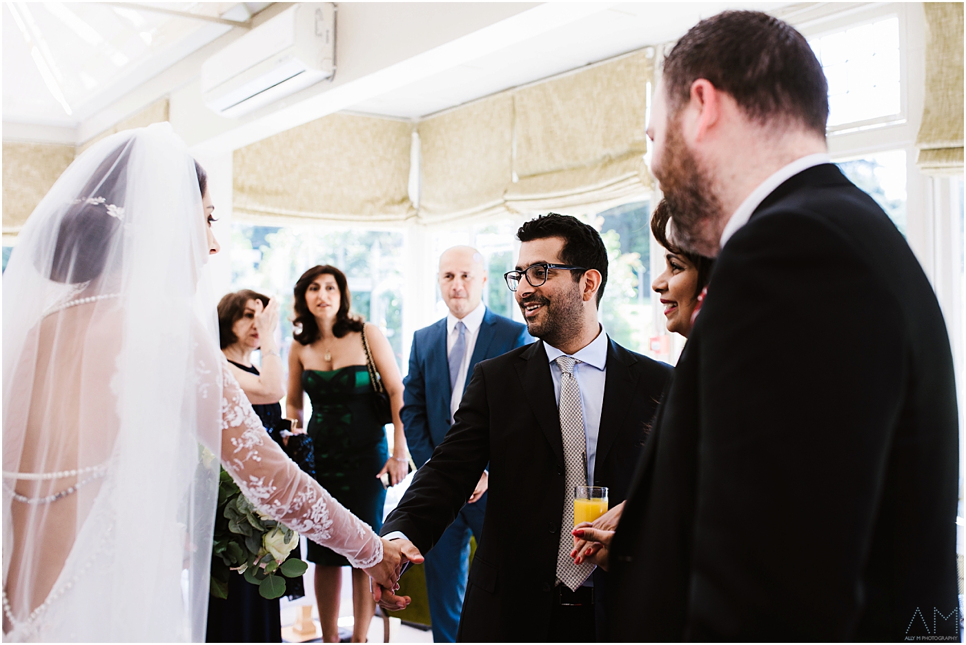 weddimng guest greeting the bride