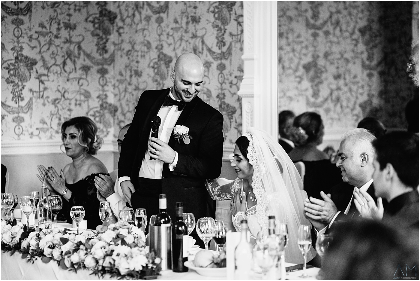 groom looking at his wife during speeches