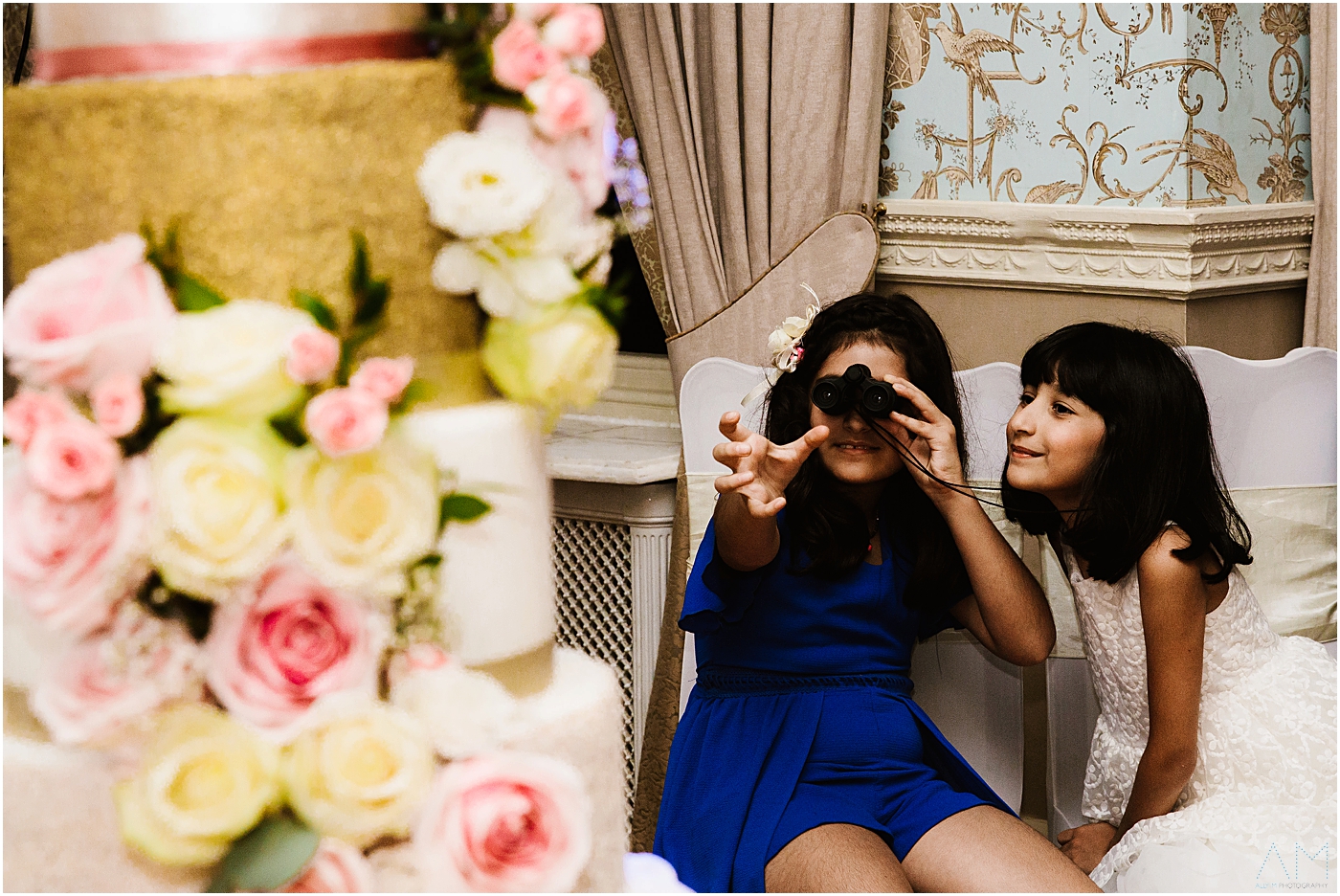 kids looking at wedding cake