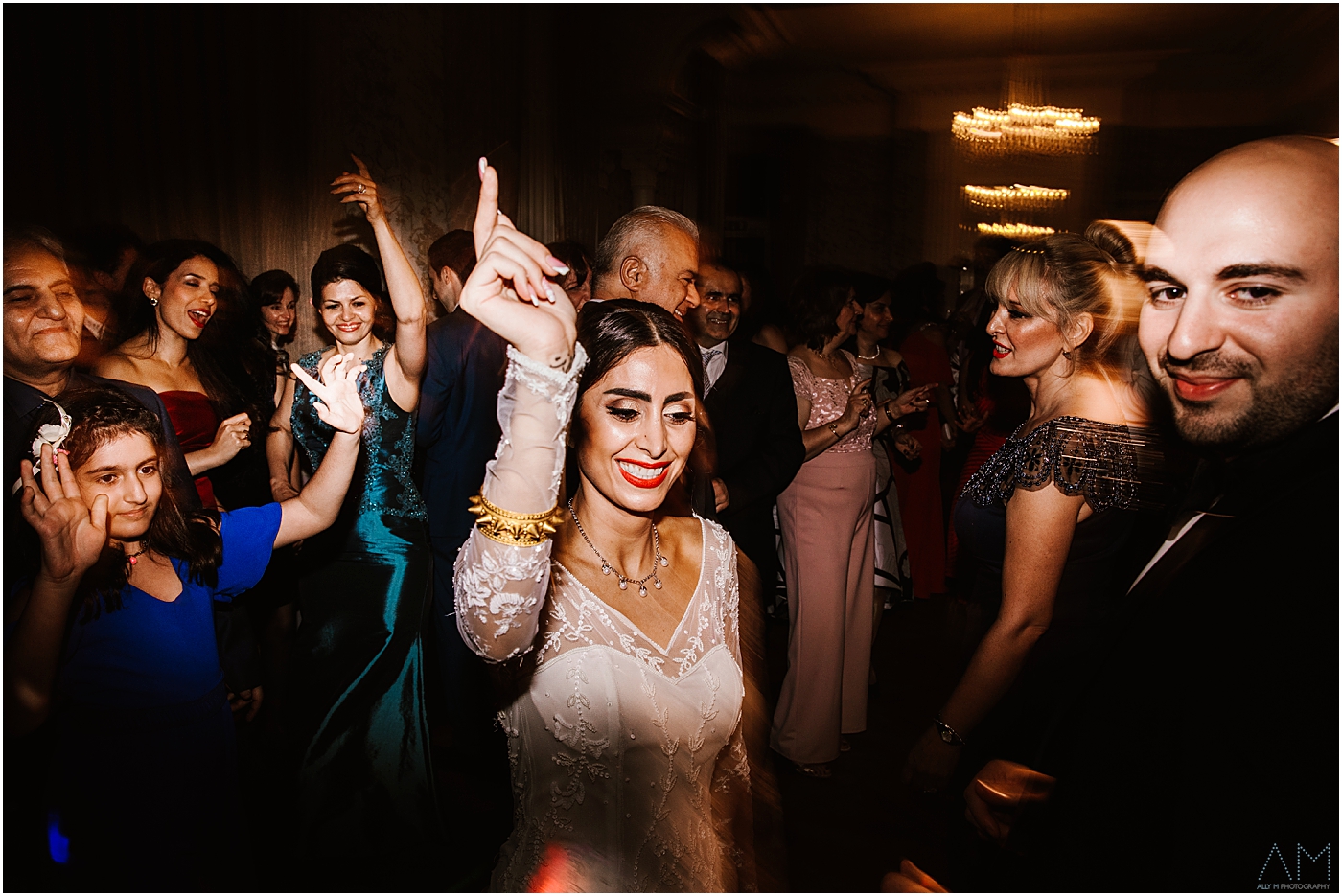 bride dancing with wedding guests