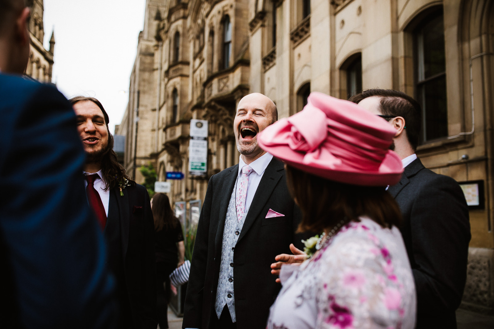 father of the groom laughing