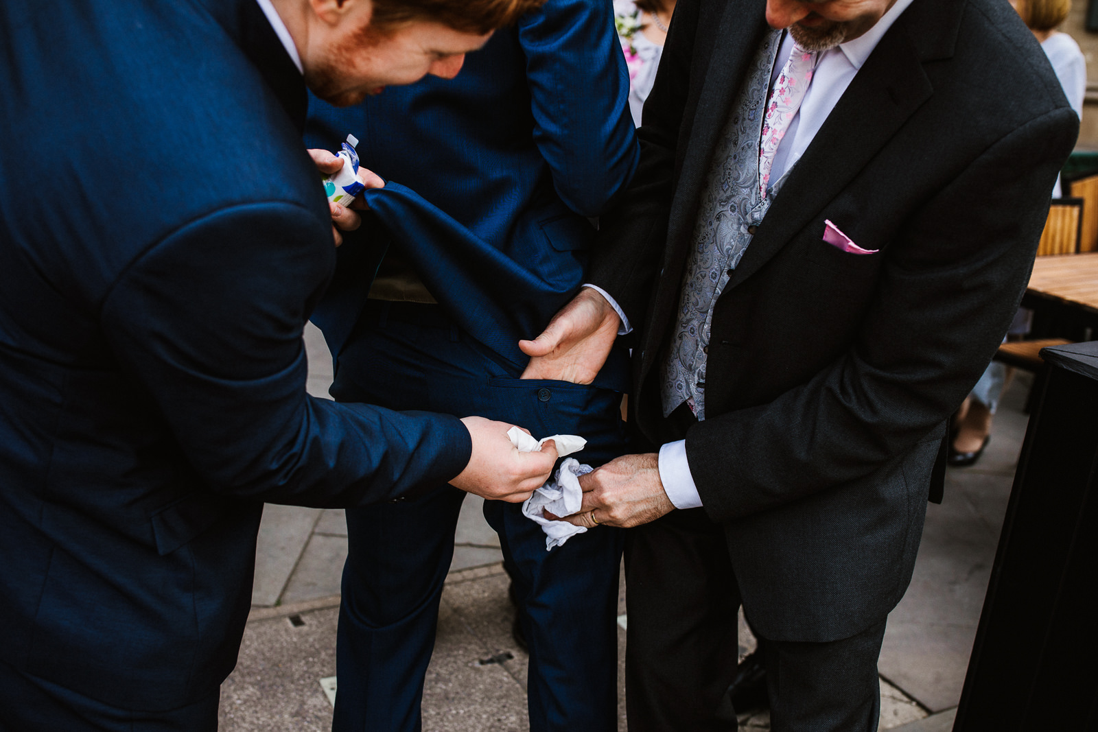 Groom has stain on pants