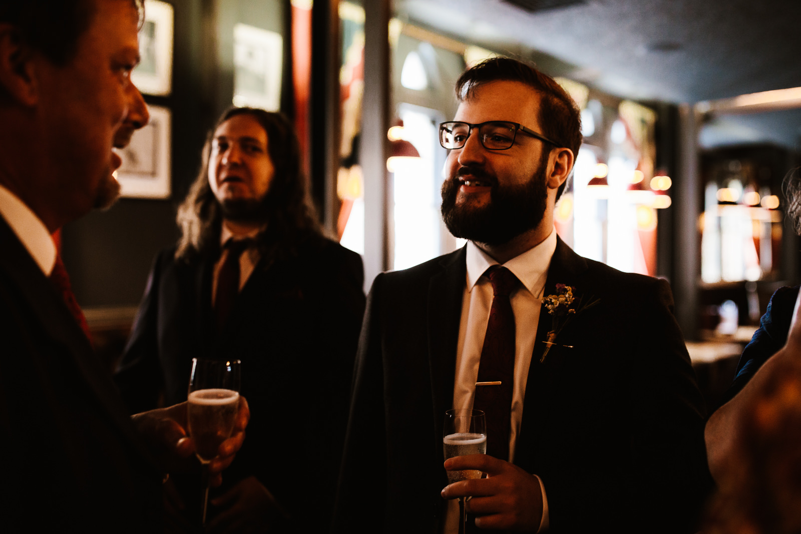 Wedding guest drinking beer