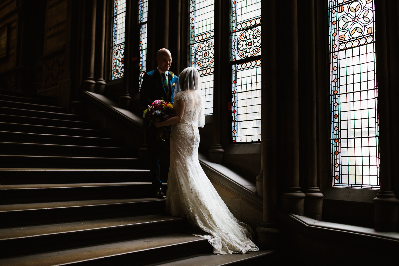 Bride and groom stood on the steps