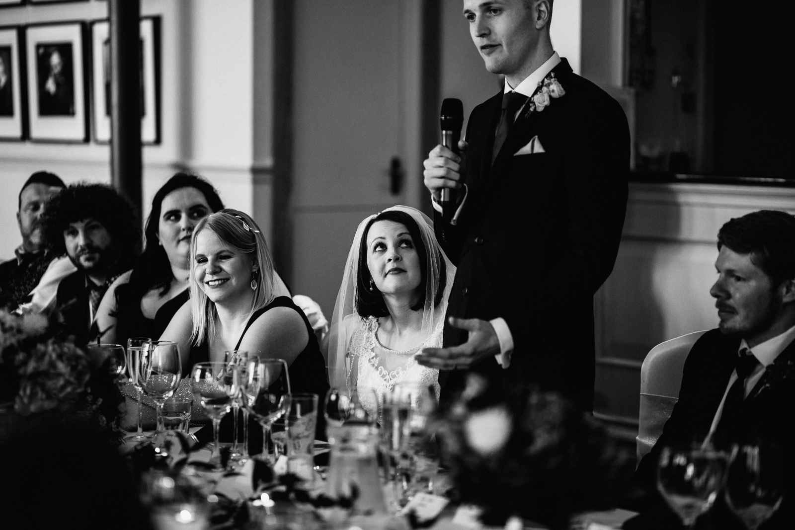 Bride looks at her man during his speech