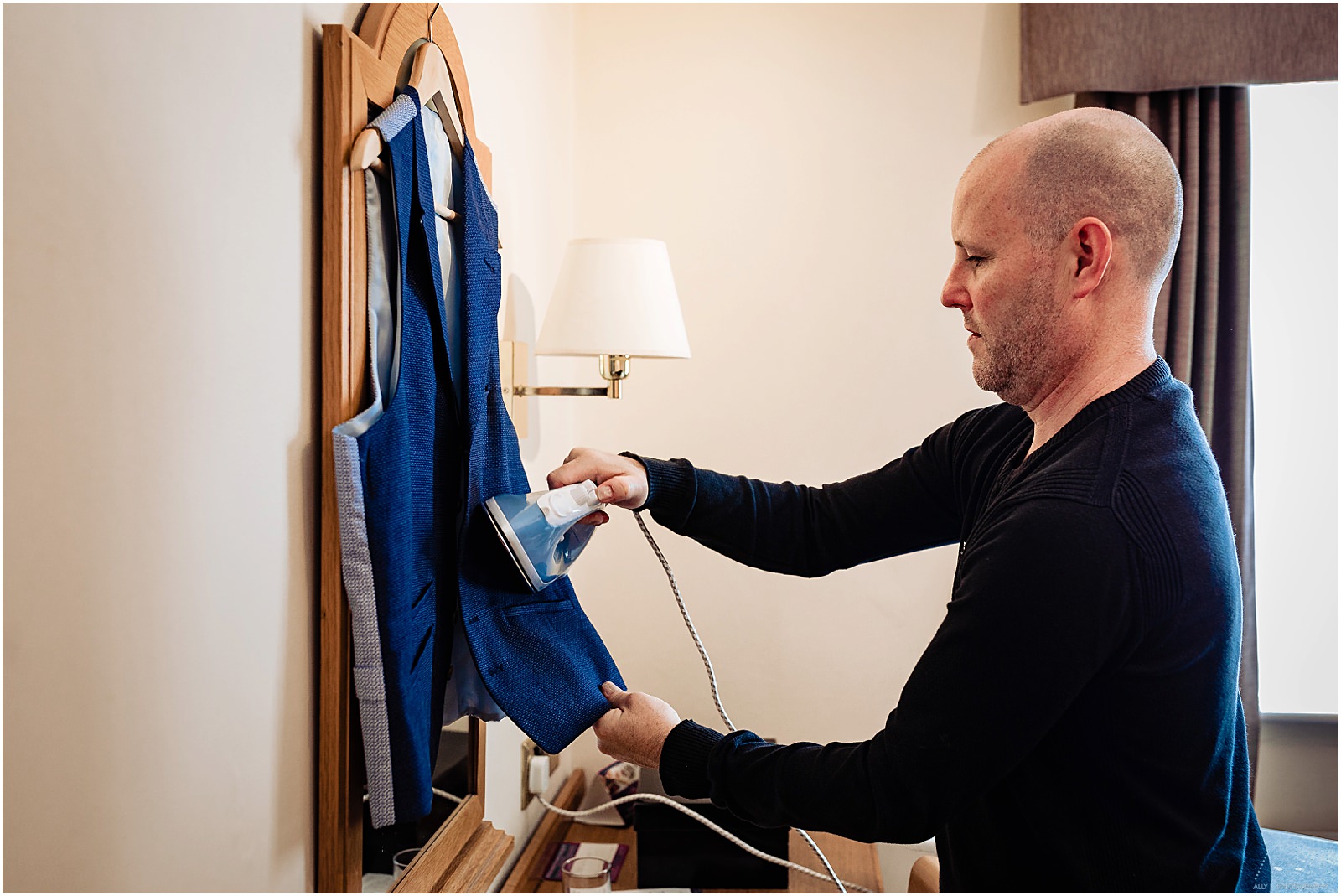 groom ironing his waistcoat