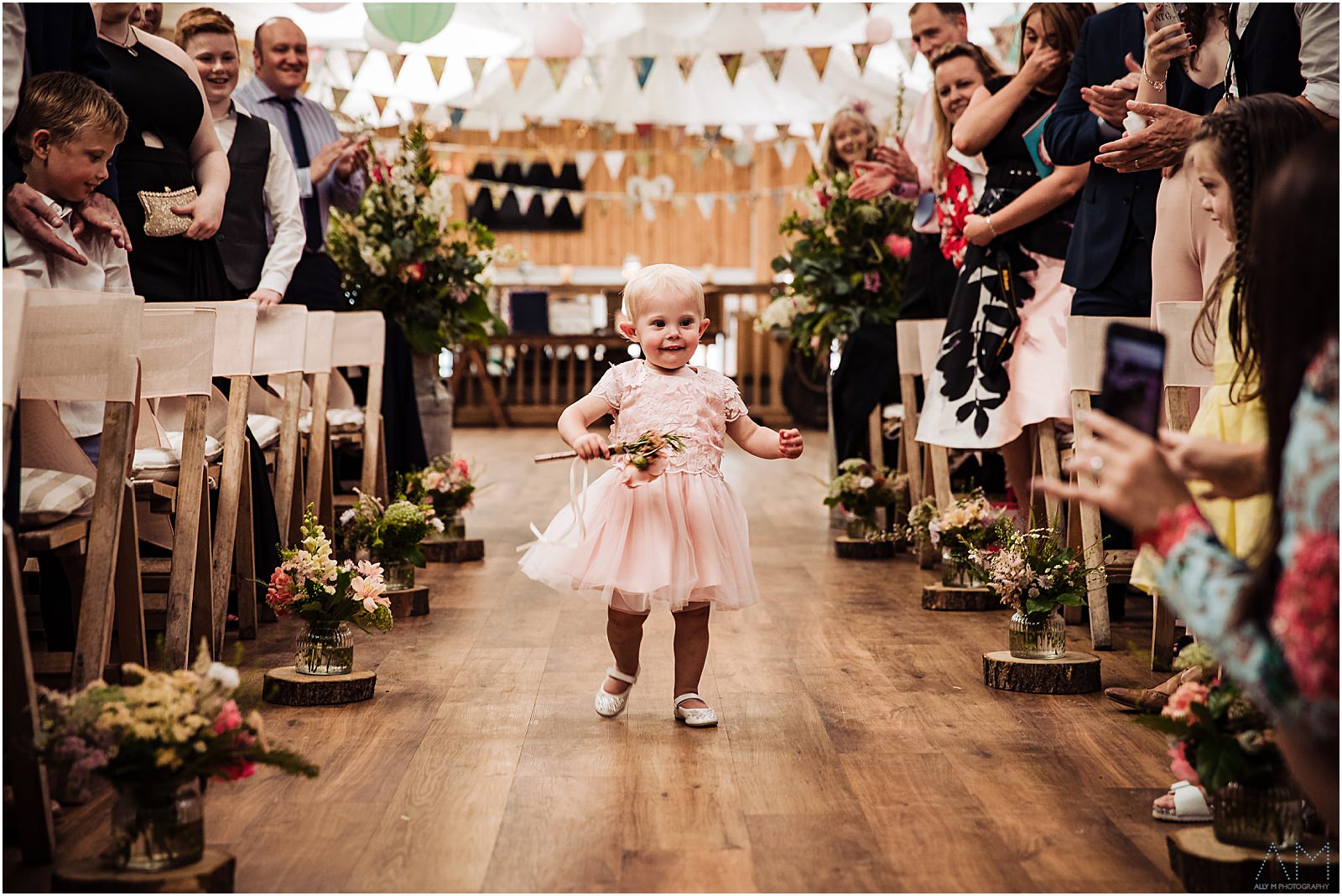 Little girl running up the aisle