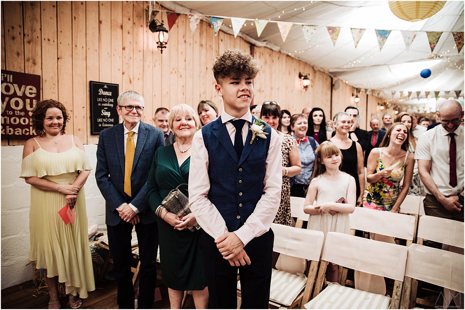 Brides son smiling during the ceremony