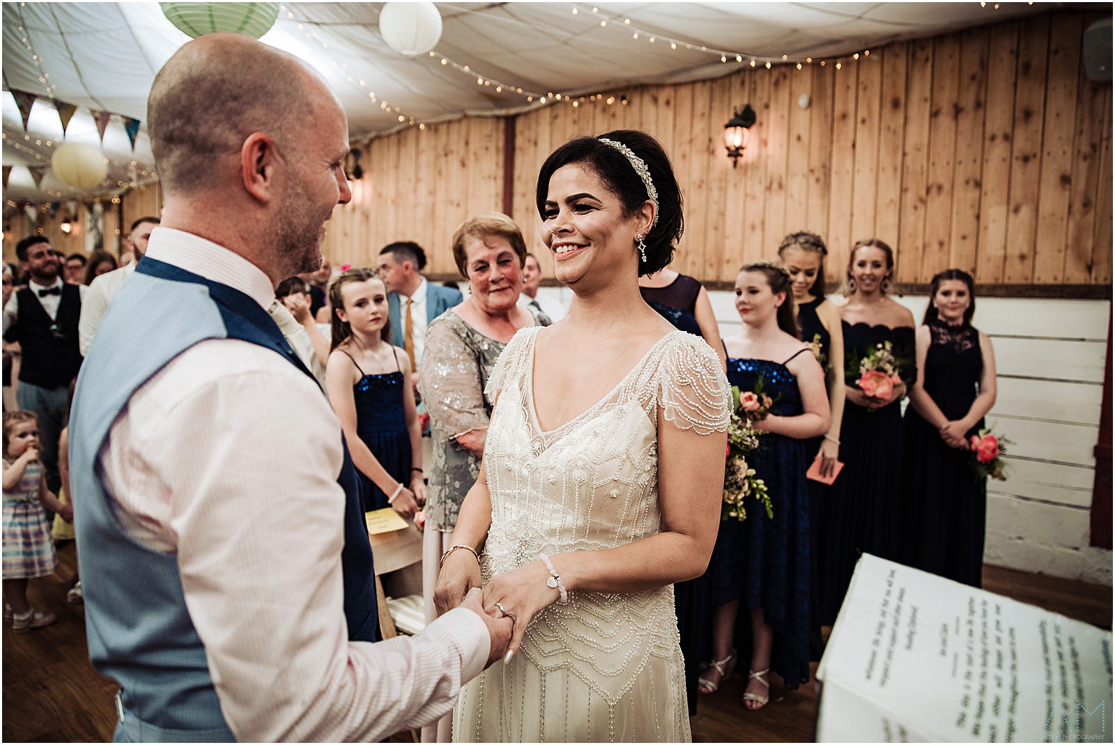Bride and groom excahnging rings at The Wellbeing farm