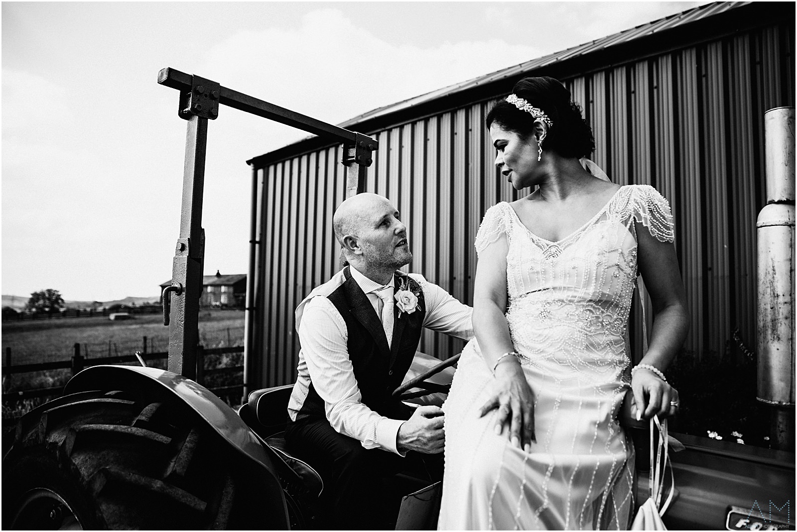 Newly weds sat on the tractor