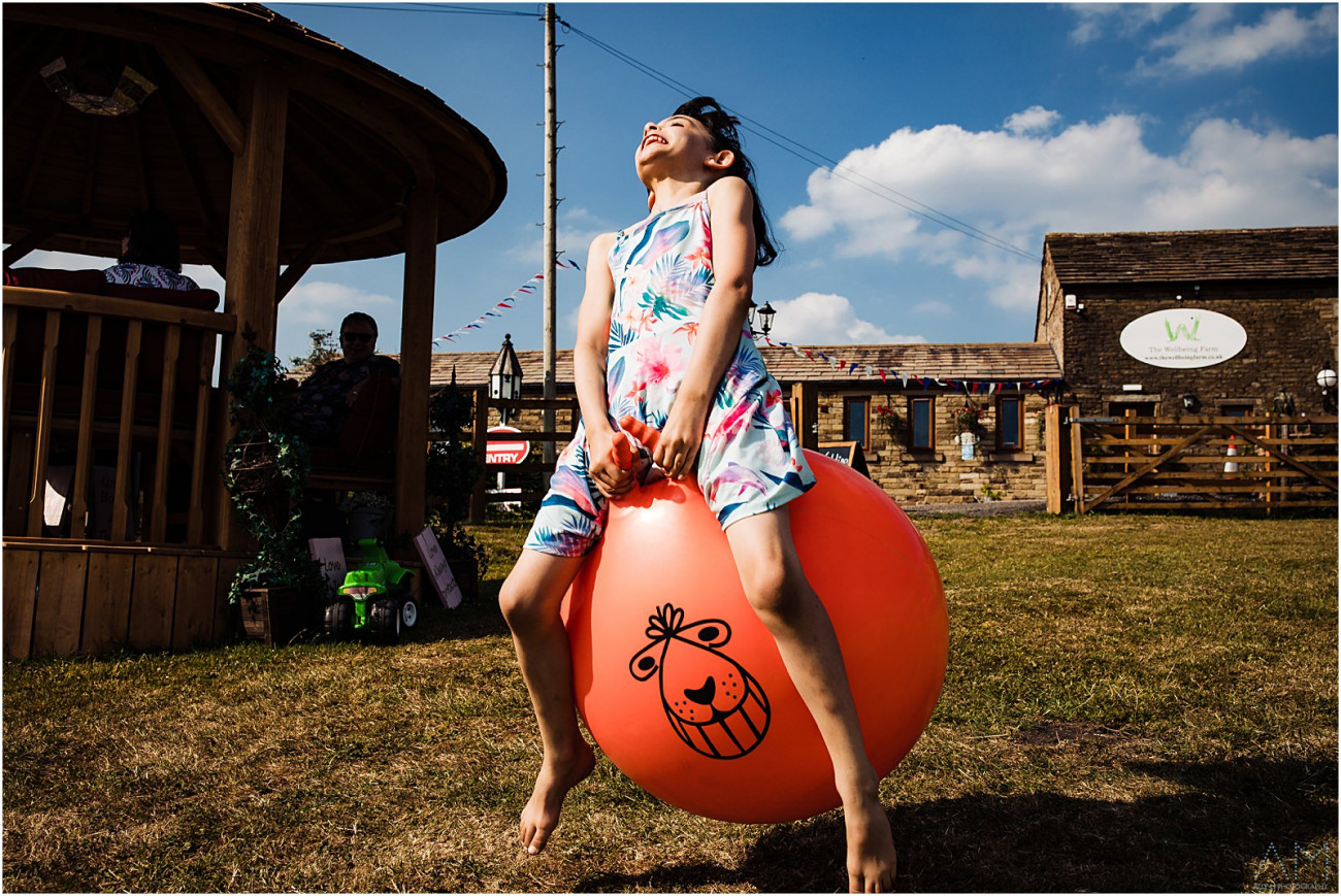 Girl bouncing on space hopper