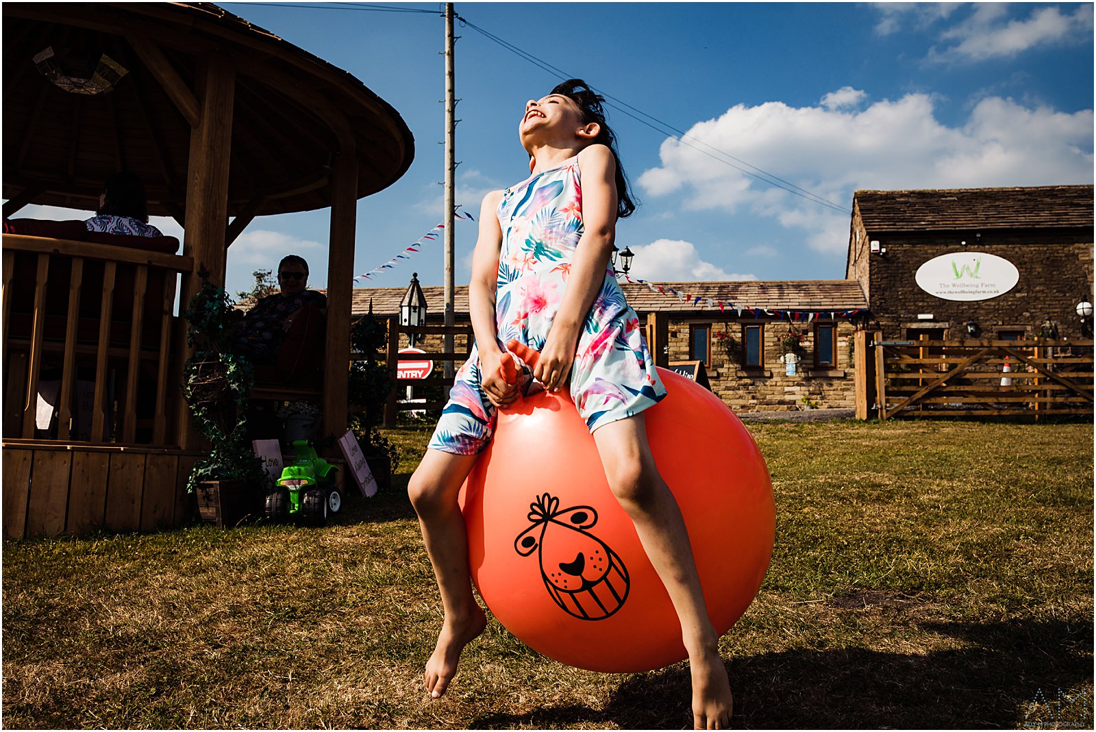 Girl bouncing on space hopper
