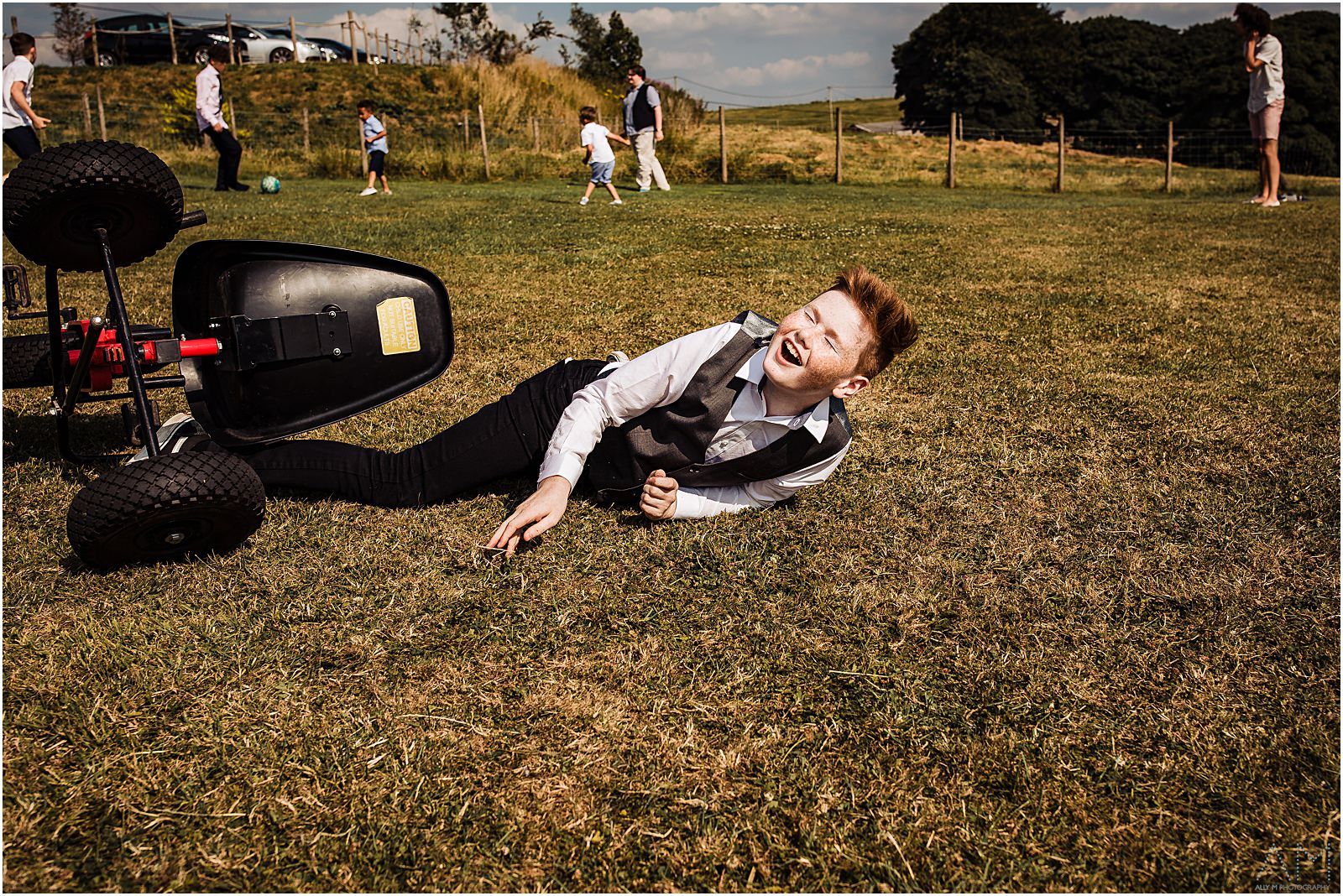 Boy falling on the grass