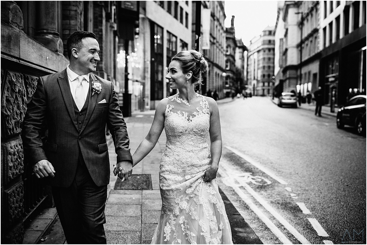 Bride amnd groom walking in manchester