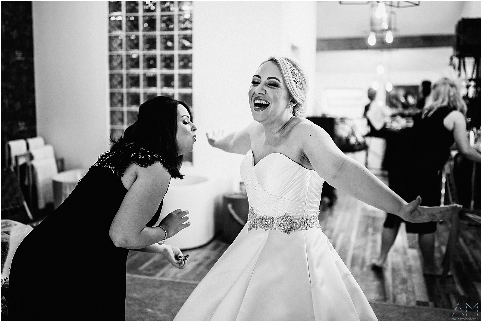 Holmes Mill Wedding | Gabby & Paul 5 Bridesmaid laughing with the bride at Holmes Mill