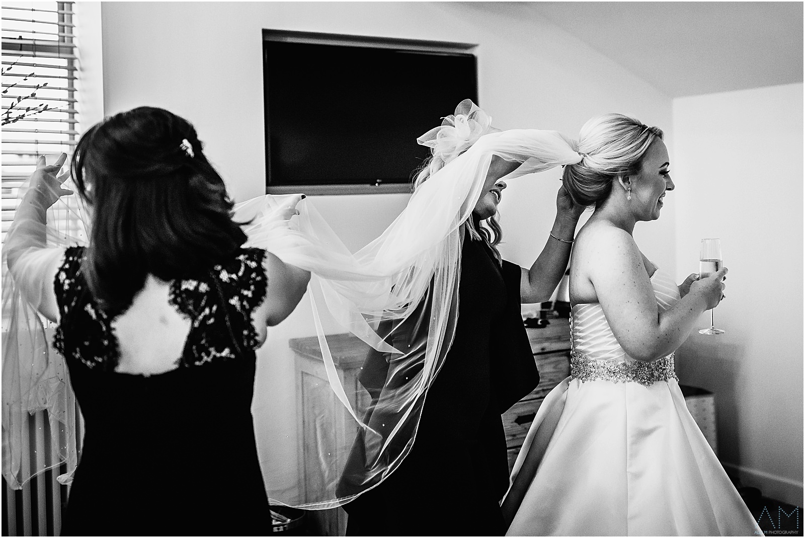 Holmes Mill Wedding | Gabby & Paul 6 Bridesmaids helping the bride with her veil
