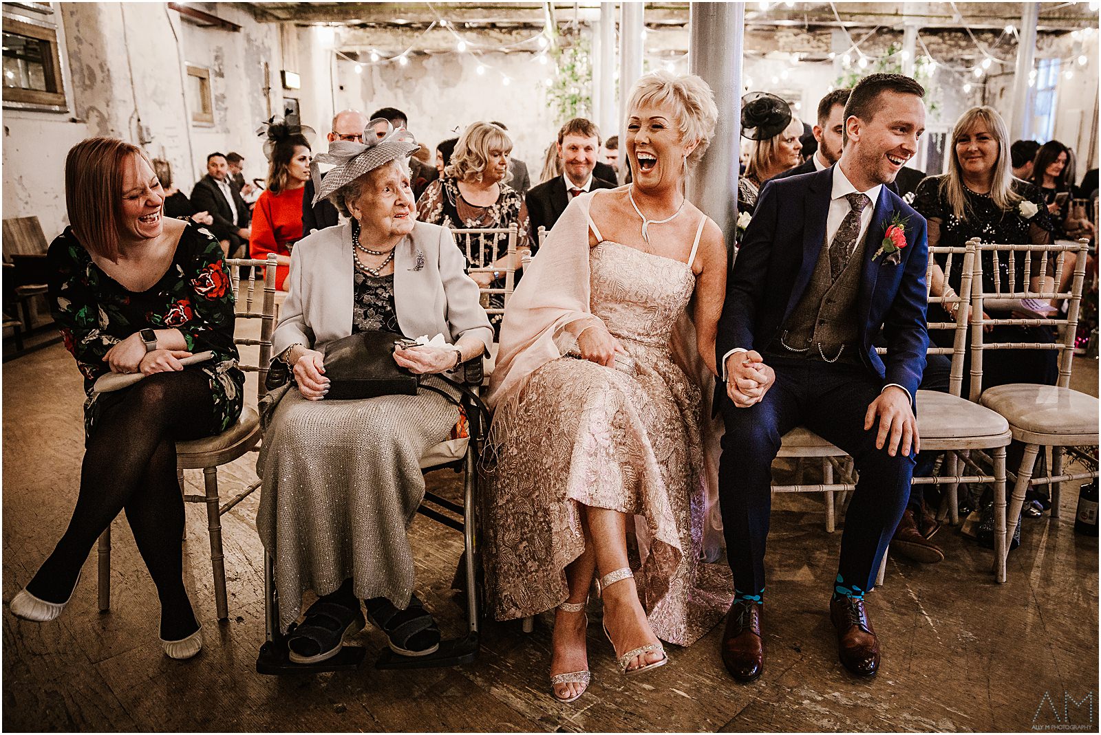 Holmes Mill Wedding | Gabby & Paul 13 Wedding party laughing together at Holmes Mill