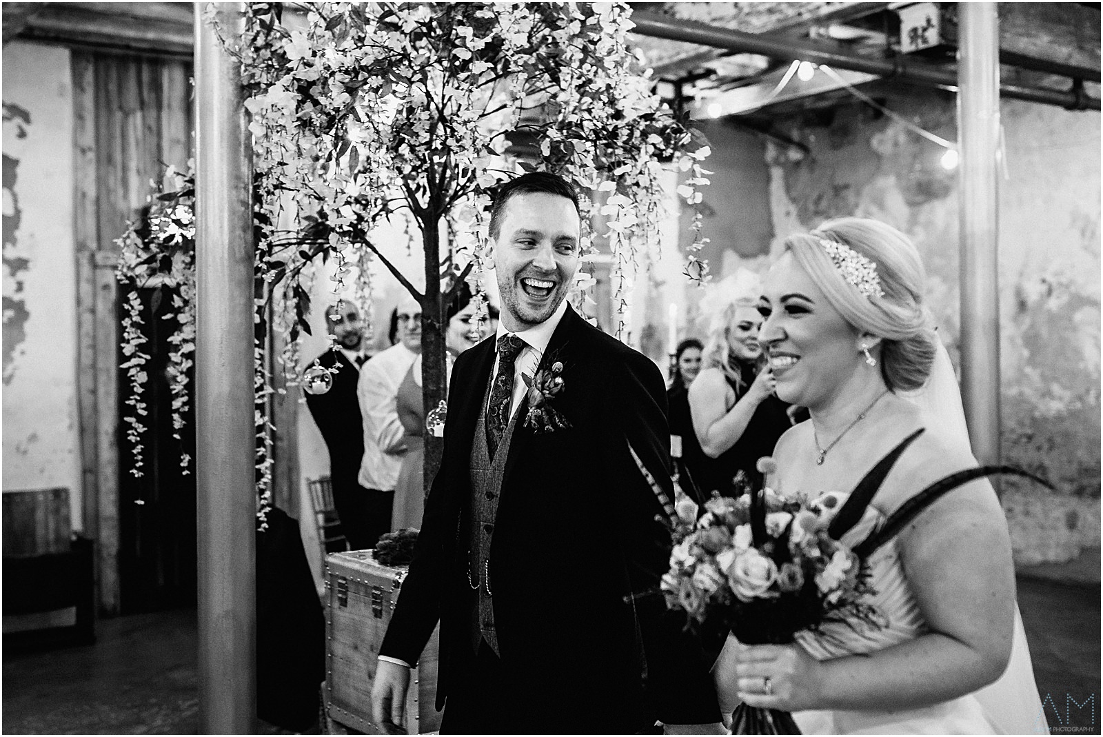 Holmes Mill Wedding | Gabby & Paul 28 Bride and groom entering the function room at Holmes Mill