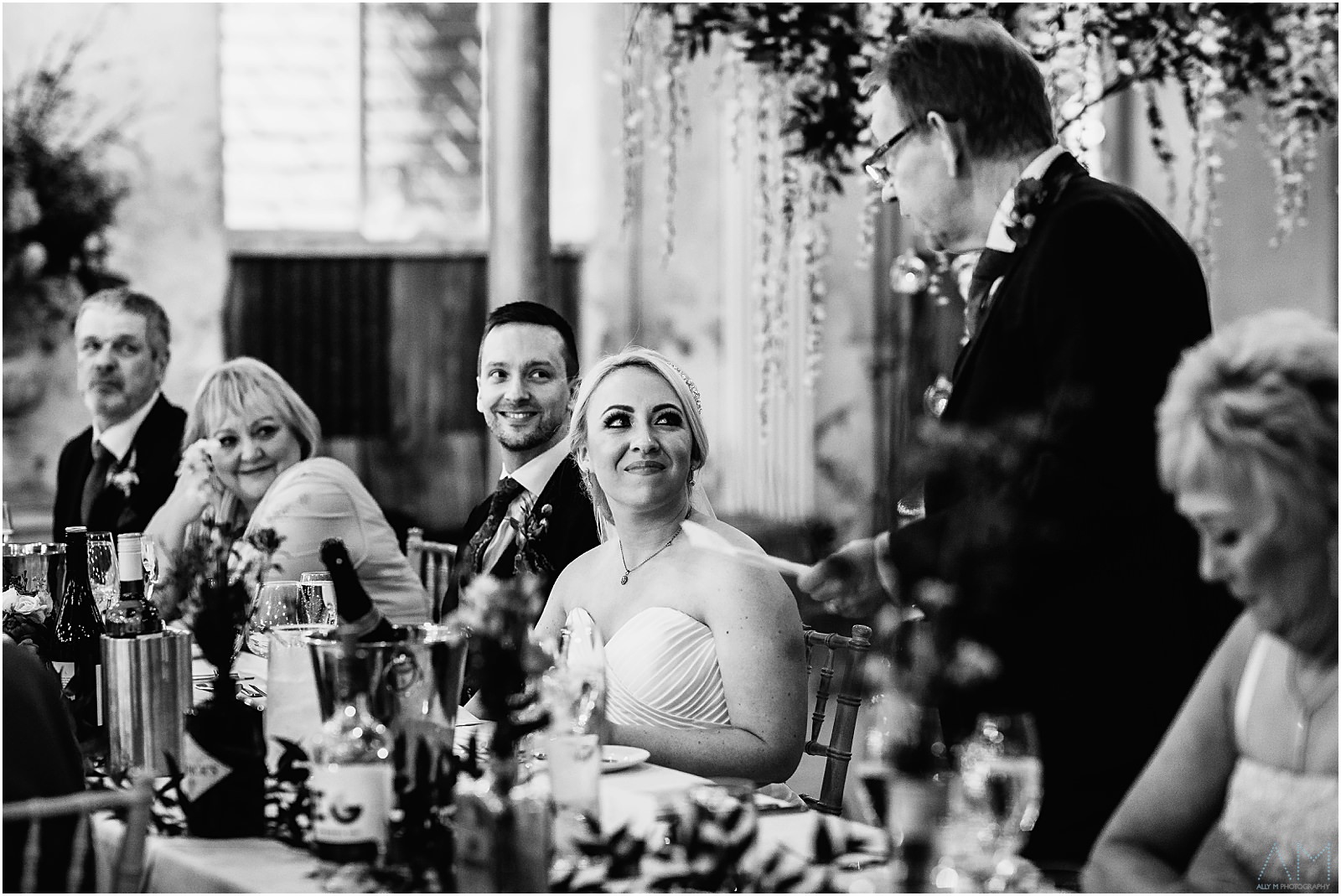 Holmes Mill Wedding | Gabby & Paul 31 Bride smiling at her Dad during his speech.