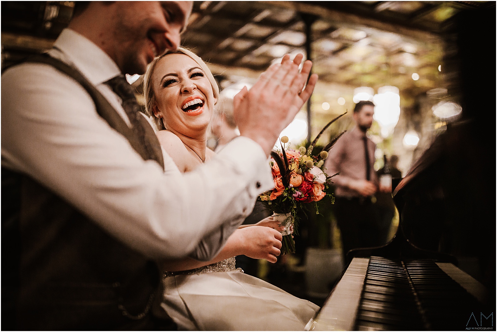 Holmes Mill Wedding | Gabby & Paul 34 Bride and groom playing the piano at Holmes Mill