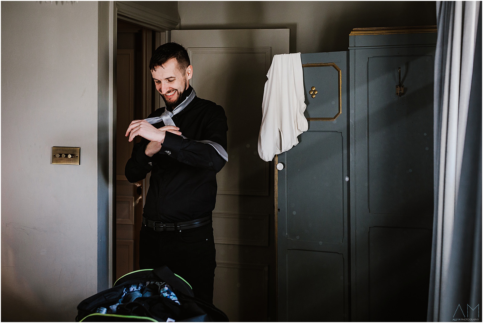 Groom getting ready at Le Petit Chateau