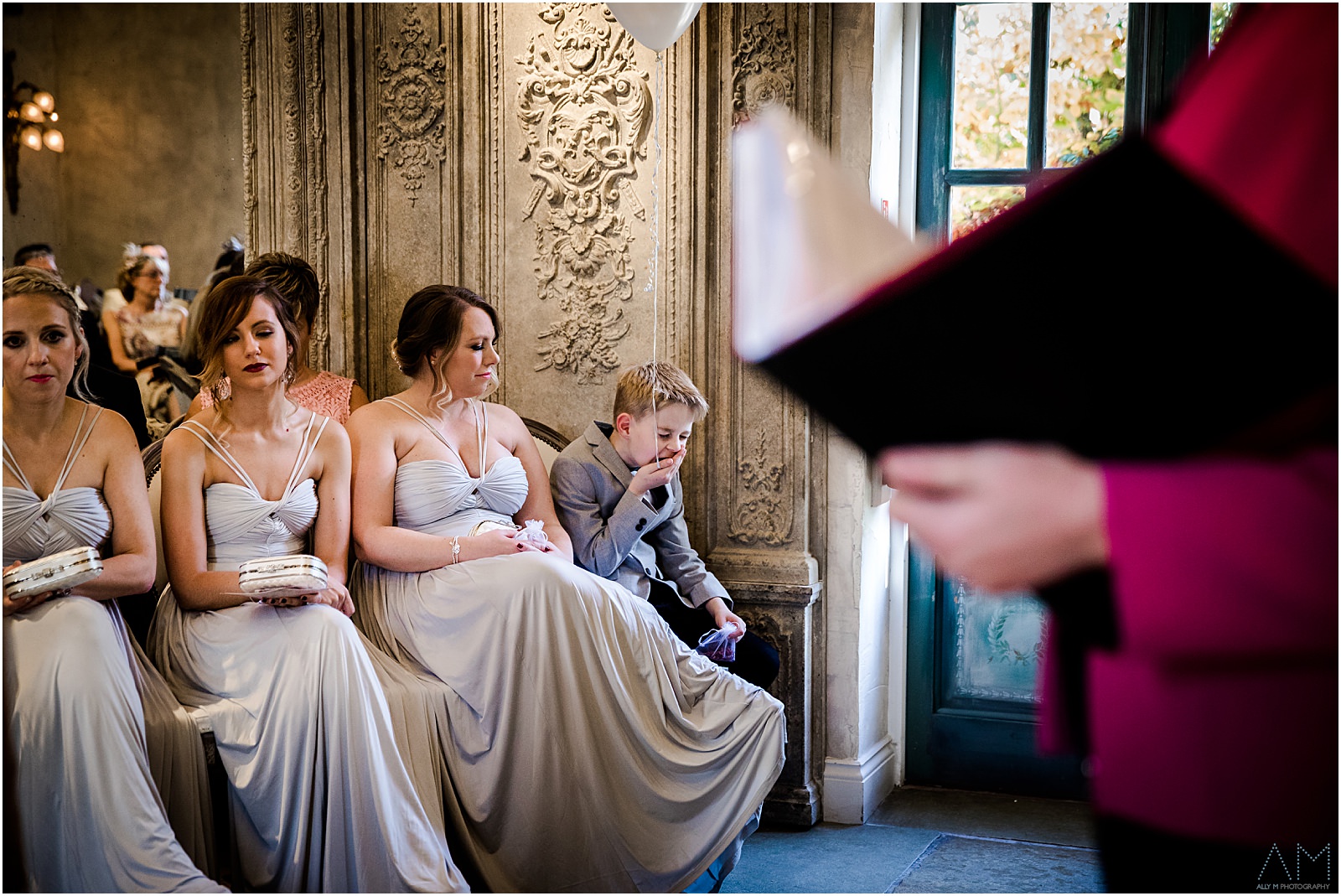 Yawning boy during wedding ceremony