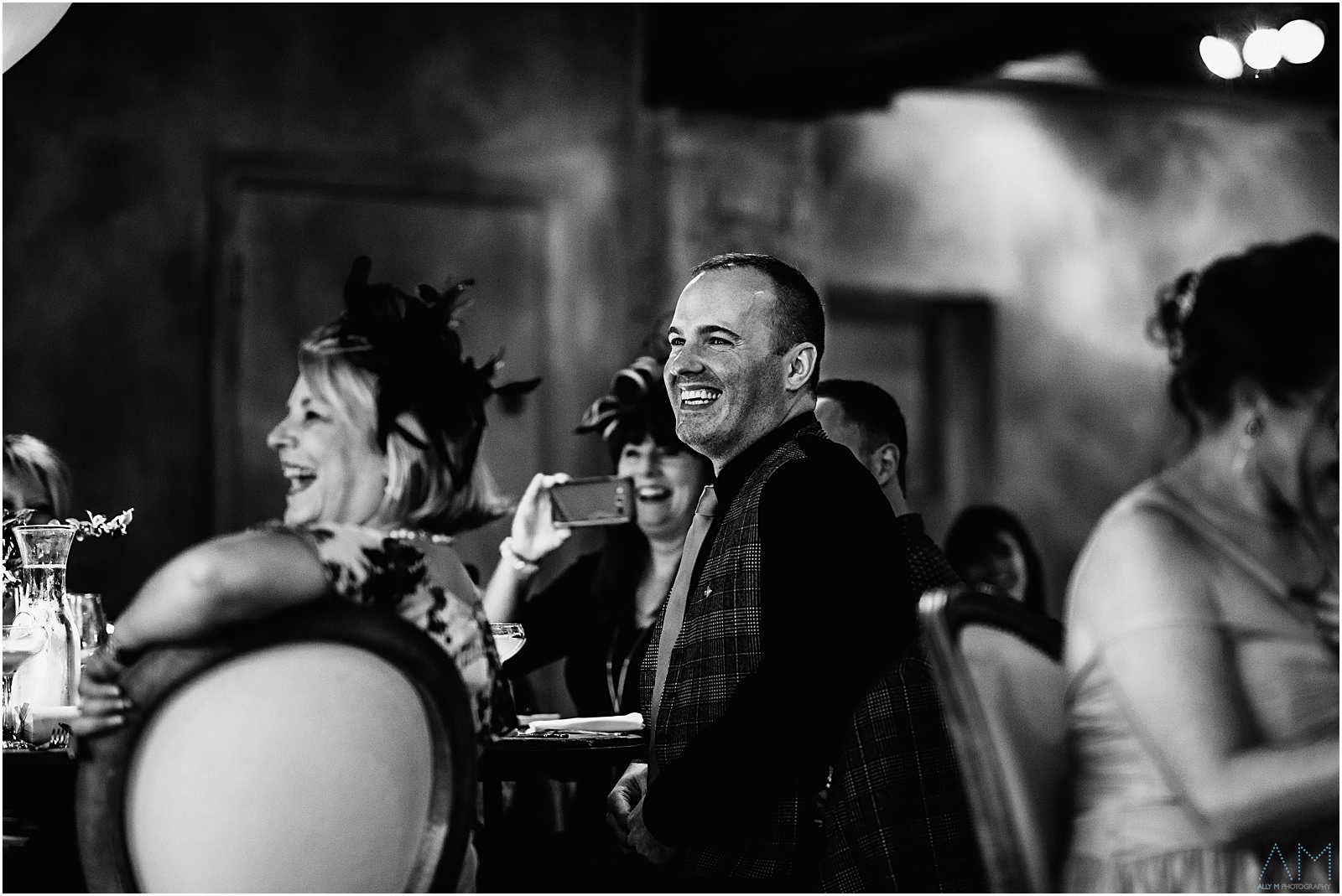 Best man smiling during the speeches