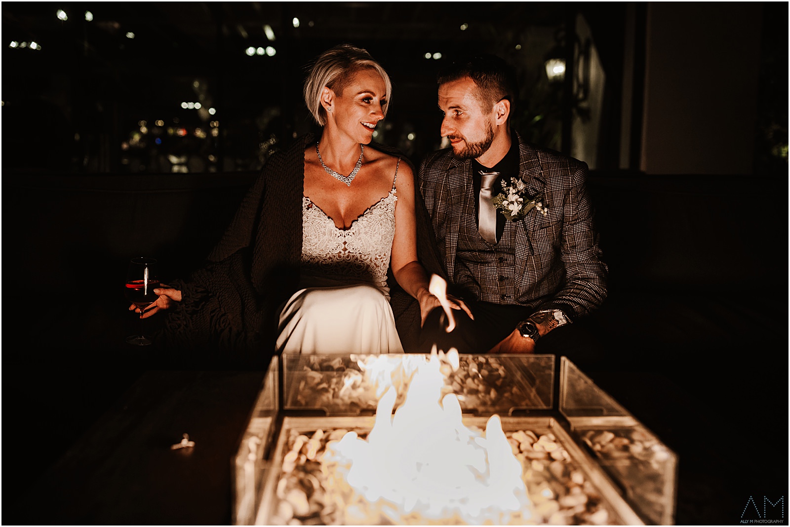 Bride and groom by the fire