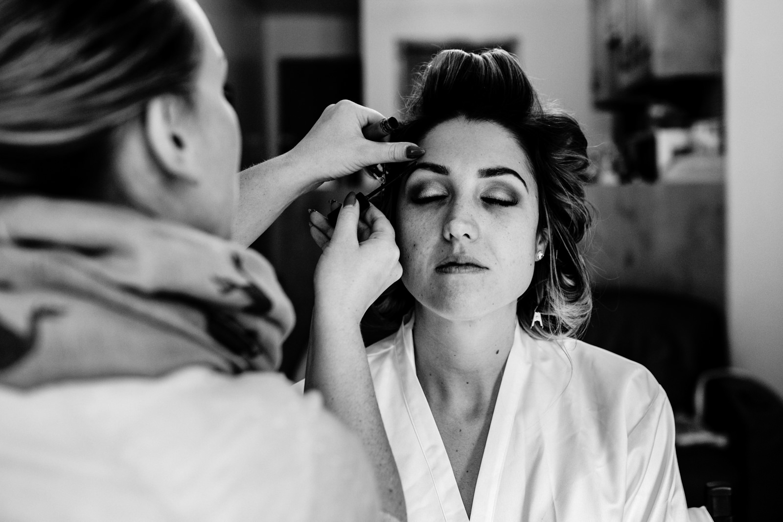 Bride having her make-up applied at Hyde Bank farm