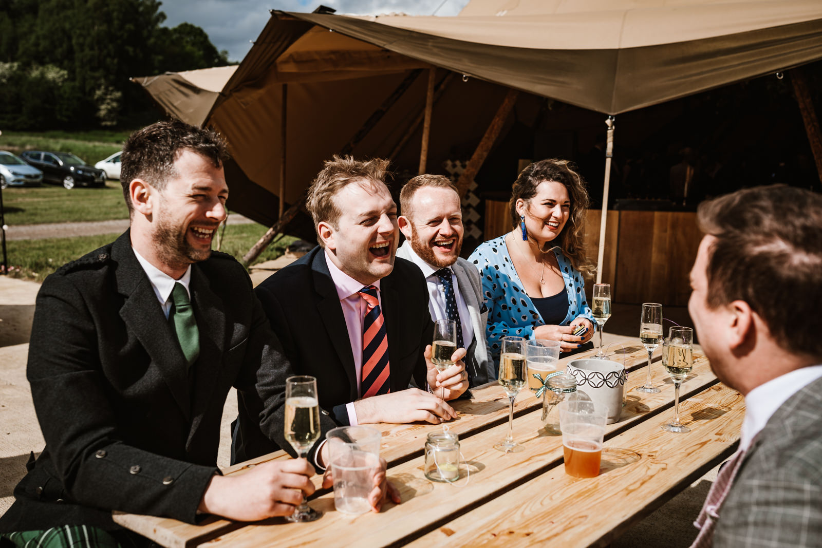 Laughing wedding guests