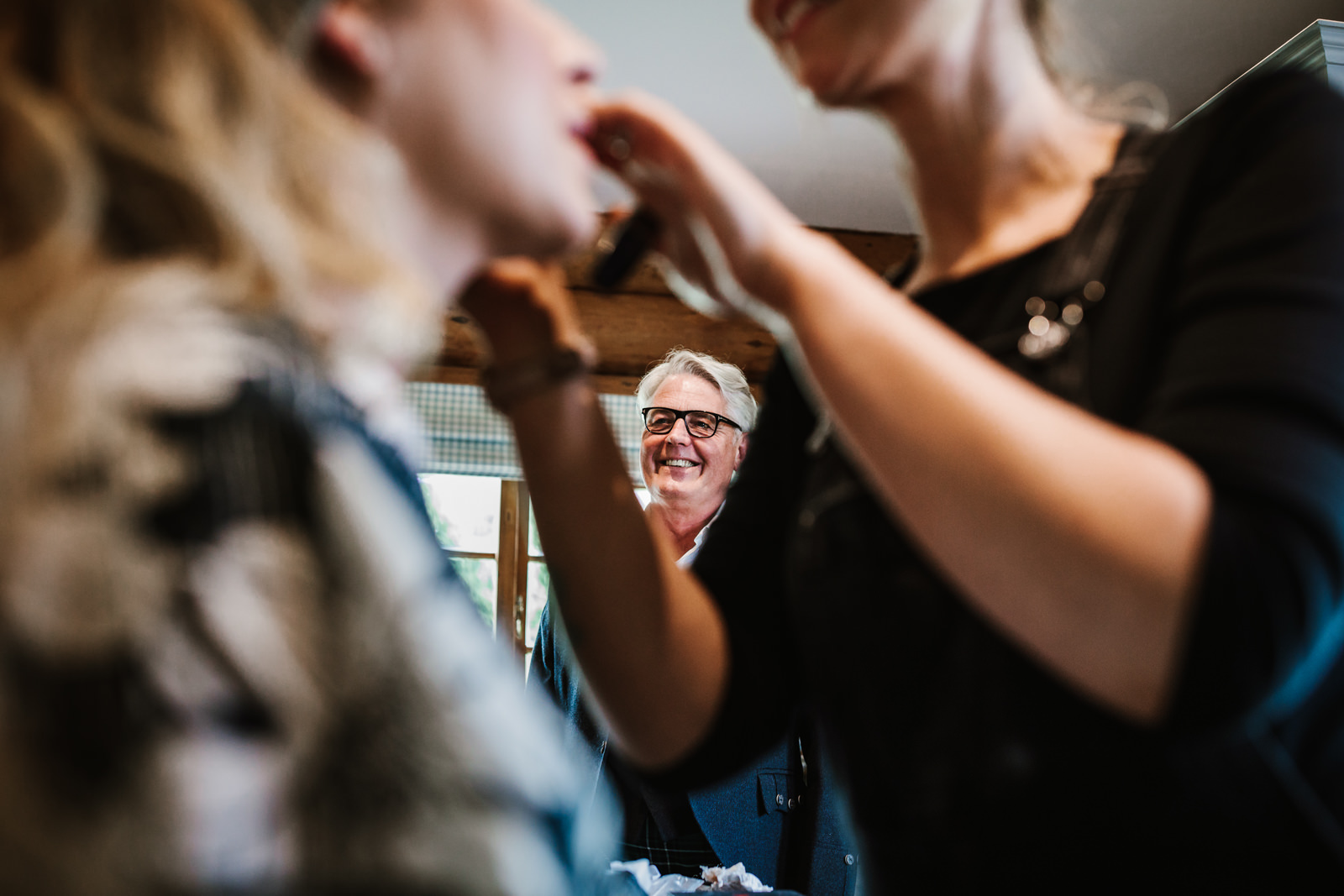 Father of the bride smiling at his daughter