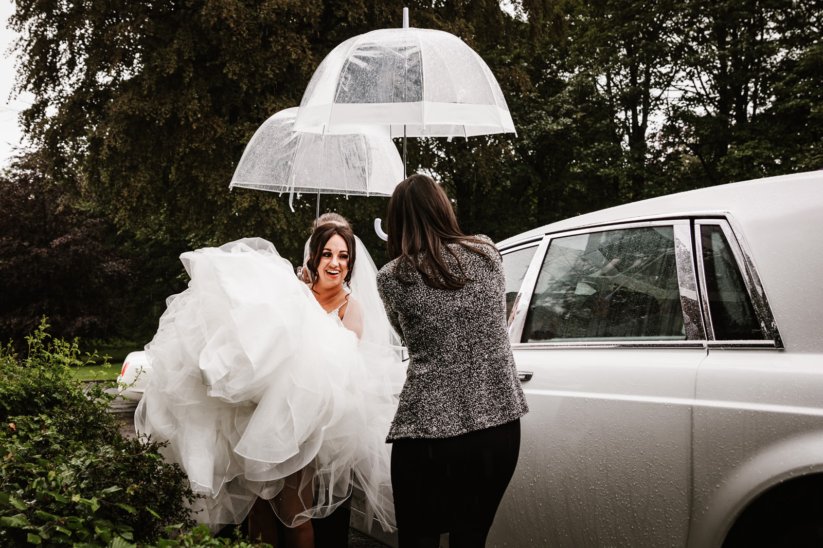 Keeping the bride dry at Rivington hall barn