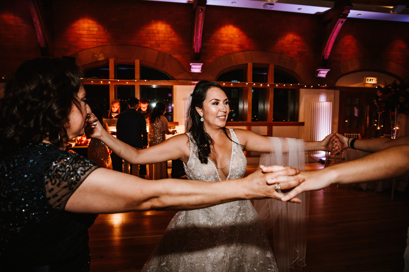 Bride on dance floor with family