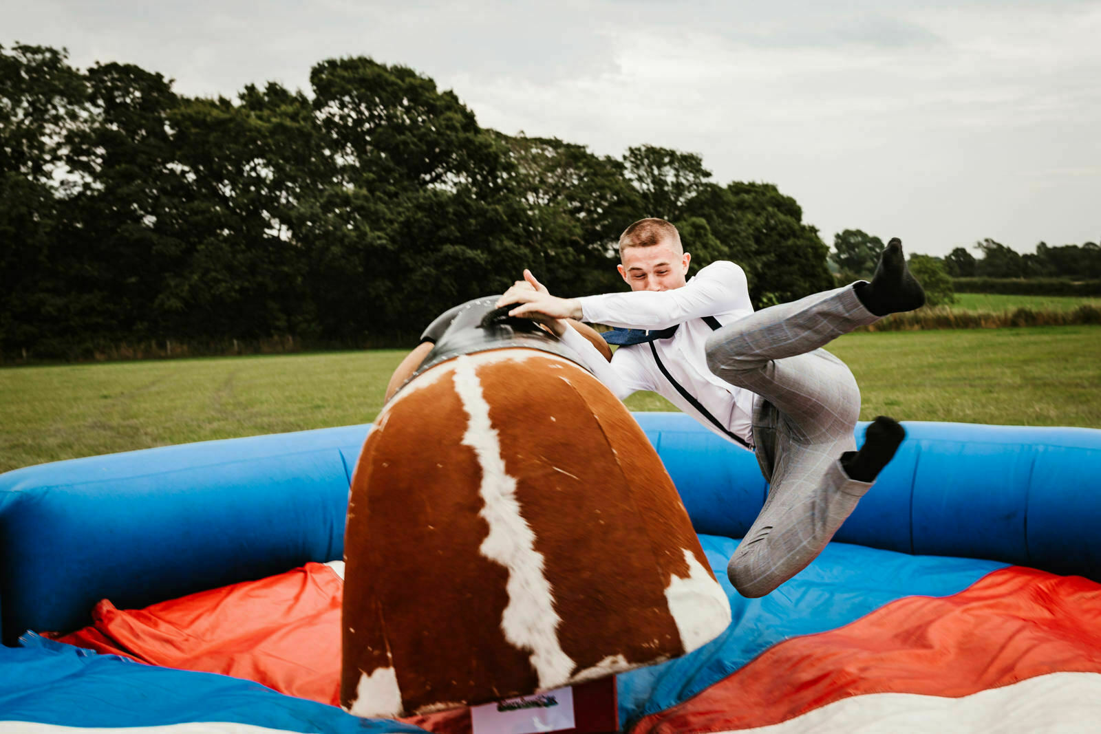 Lester Meadows Tipi Wedding Cheshire 63 Falling off the bull