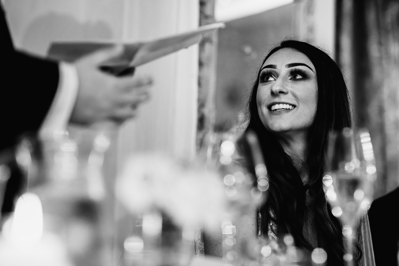 Bride smiling at her man during the speeches