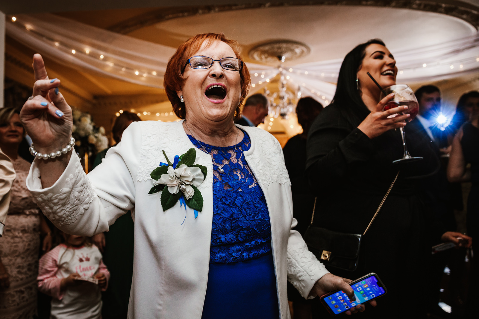 Happy wedding guest at Eaves Hall