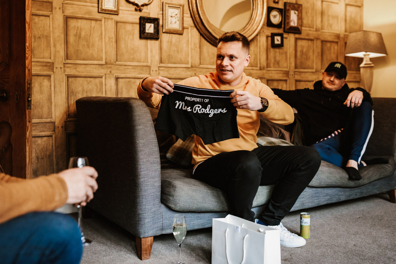 Groom opening his present
