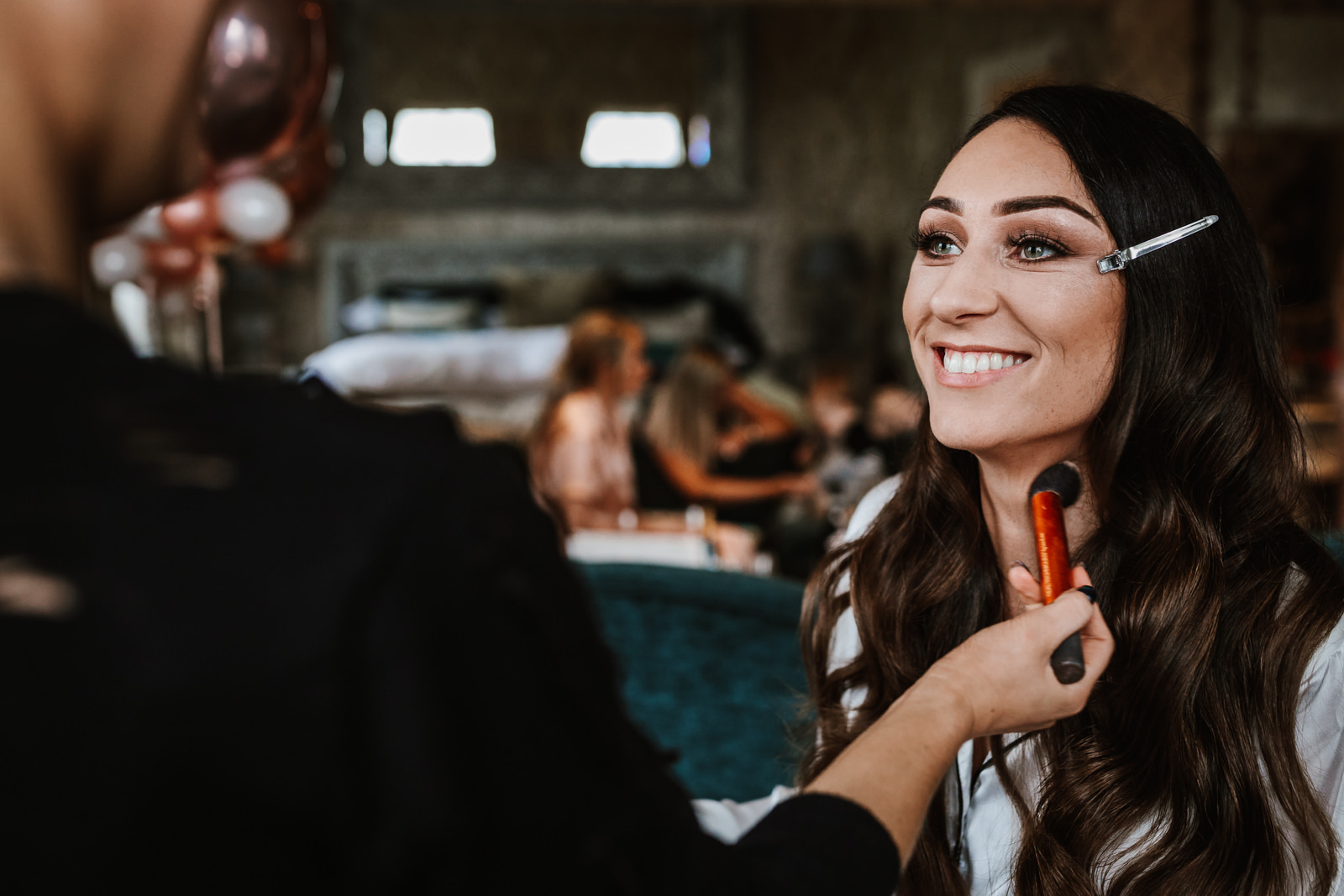 Bride having her make-up applied