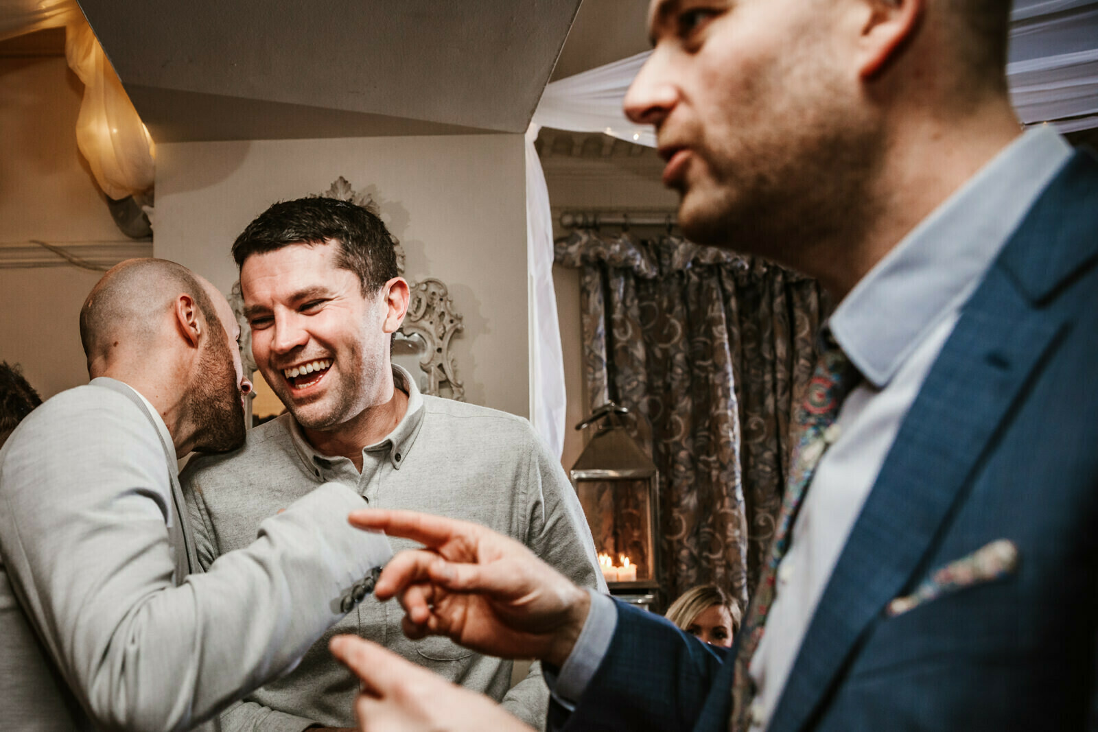 Wedding guests laughing