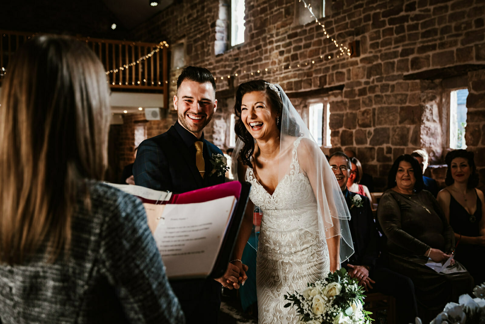 Bride and groom during the ceremony at The Ashes Barns