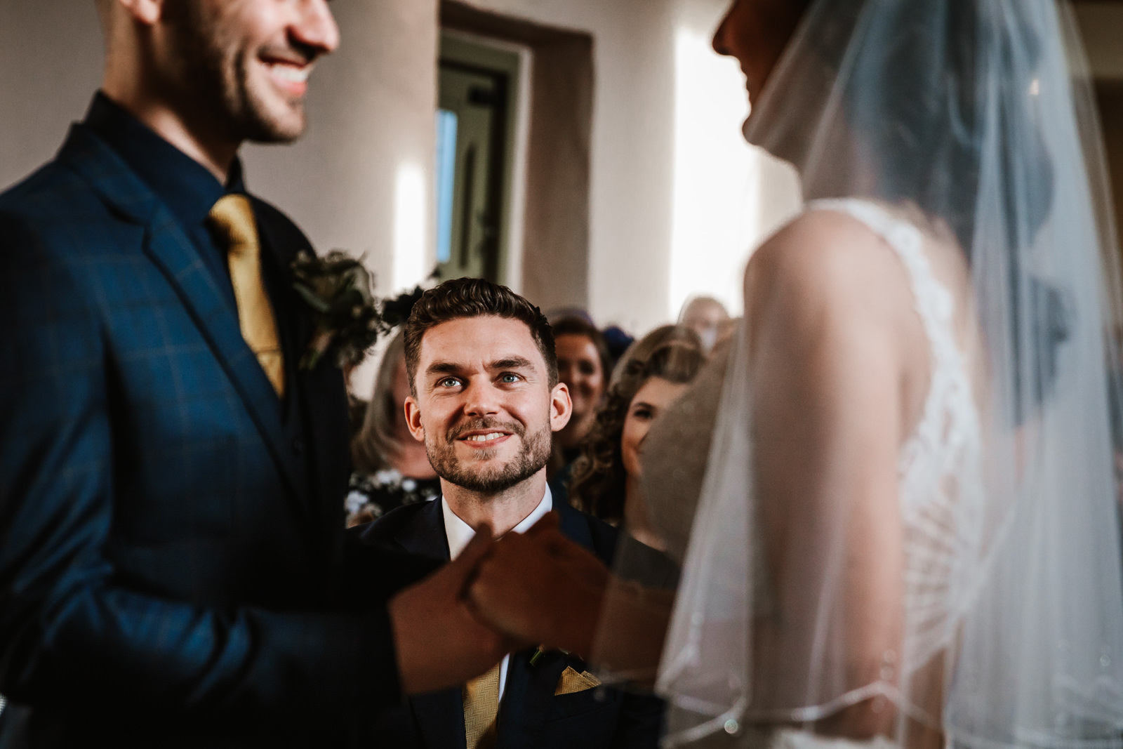 Best man looking on