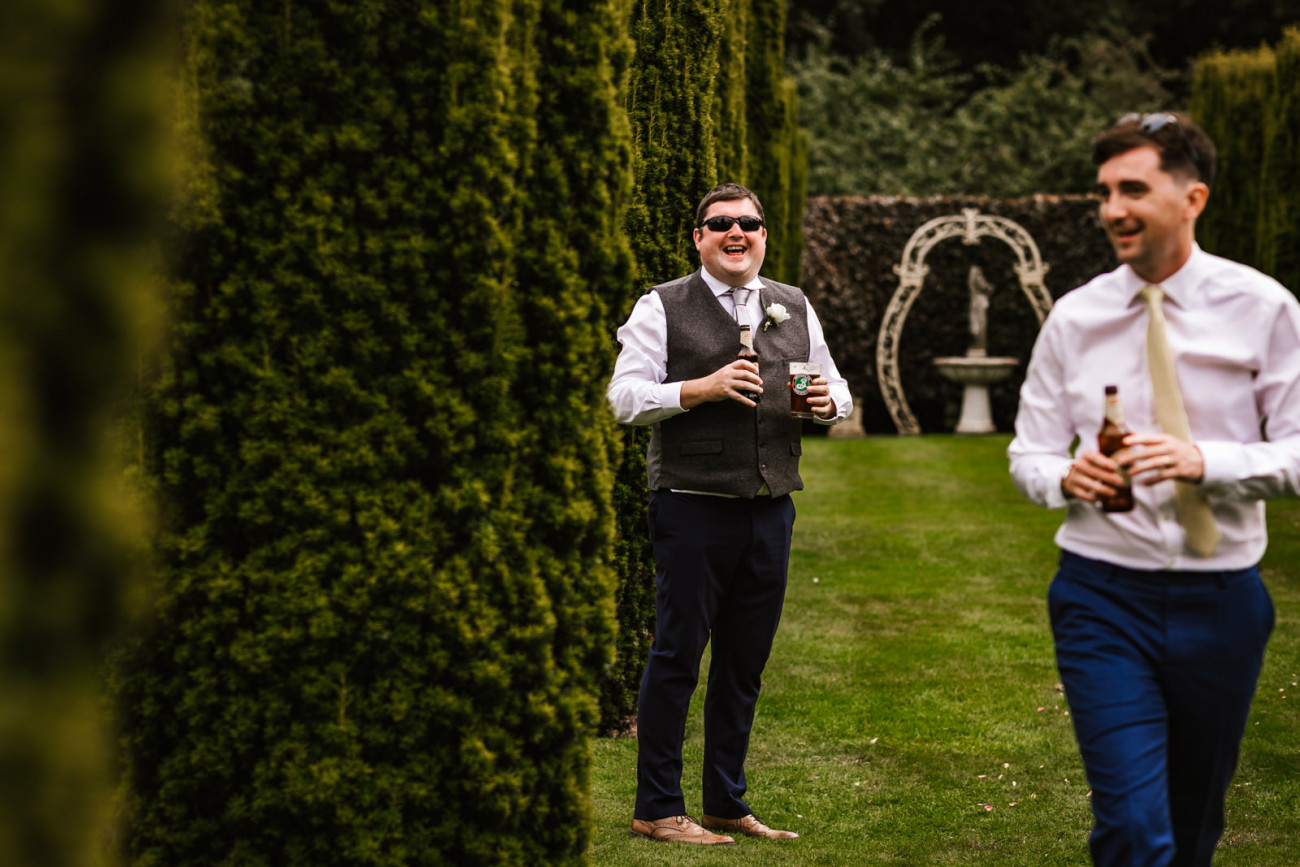 Wedding guests in the gardens at The Holford Estate