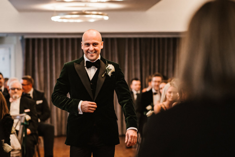 Groom walking down the aisle