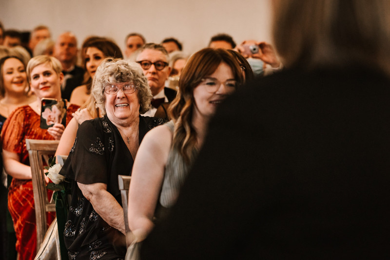 WEdding guest laughing