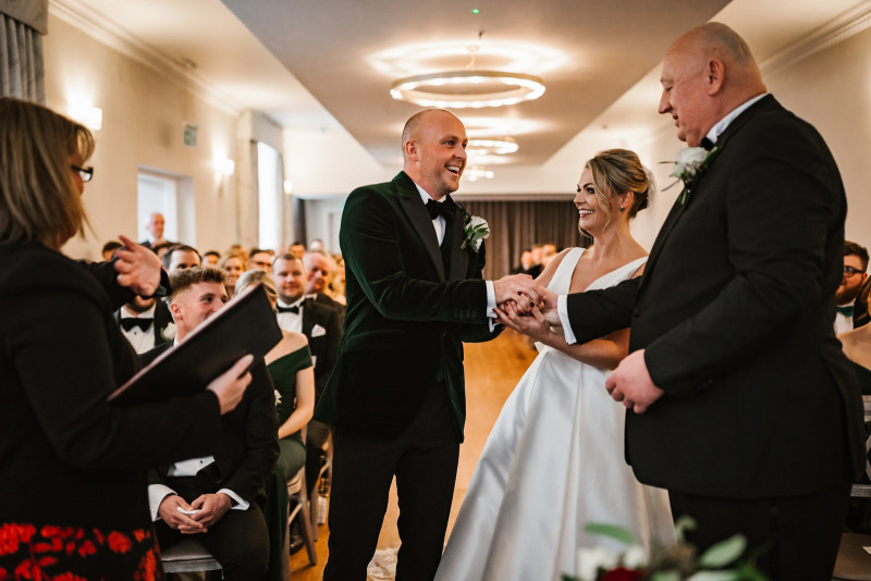 Father of the bride shaking the grooms hand