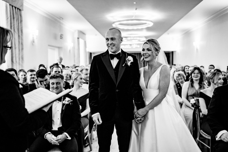 Bride and groom smiling during the ceremony Old Palace