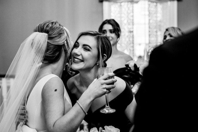 Kiss for the bride from the bridesmaid