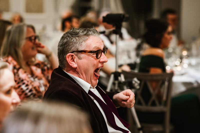 Wedding guest laughing