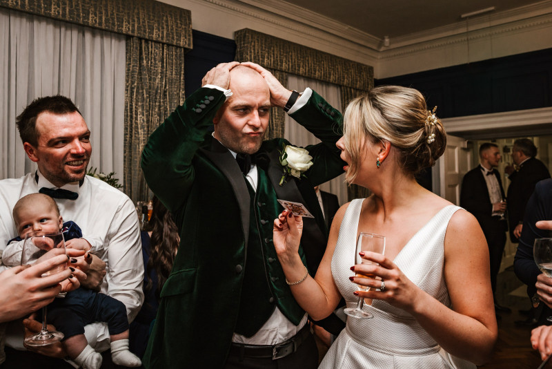 Baffled groom at magic trick