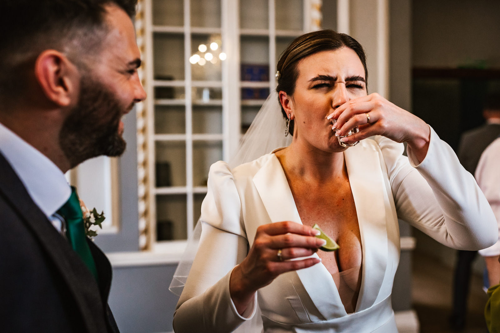 Bride having a shot at Manchester hall